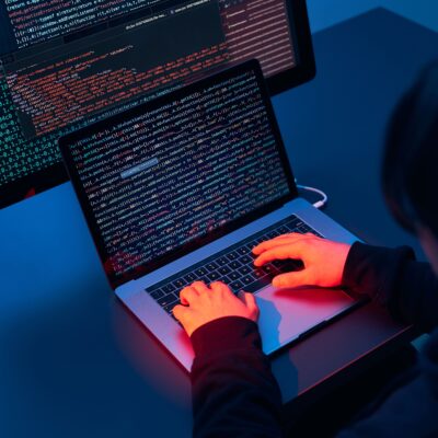 man-using-computer-and-programming-to-break-code-2022-11-14-12-02-19-utc-min