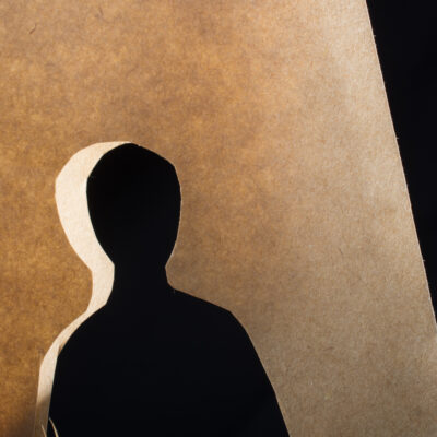 man-shape-cut-out-of-paper-in-hand-in-the-view-2026-01-11-08-16-40-utc