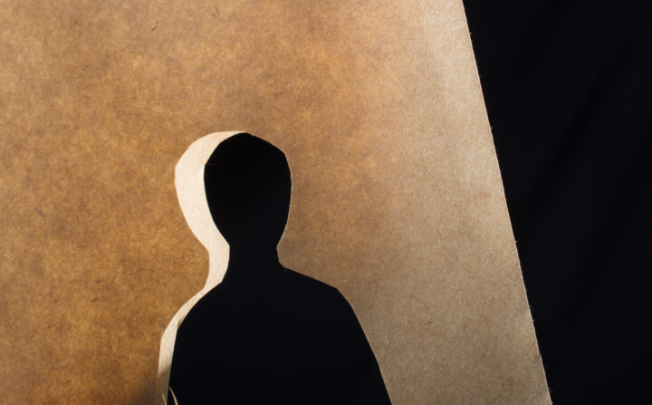 man-shape-cut-out-of-paper-in-hand-in-the-view-2026-01-11-08-16-40-utc